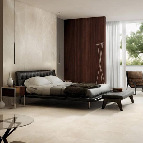 Modern bedroom with a bed, nightstands, and a large window featuring a seamless look from large porcelain panels.